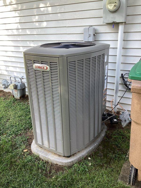 Responded to customer complaint of water running noise from HVAC system located in garage. Inspected Lennox outdoor condensing unit and verified proper operation of all components. System found operating within normal parameters with no mechanical issues identified. Thermostat displaying correct temperature readings and maintaining proper heating/cooling setpoints. No water leaks or abnormal sounds detected during inspection.