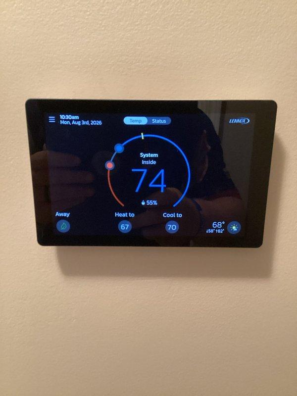 Responded to customer complaint of water running noise from HVAC system located in garage. Inspected Lennox outdoor condensing unit and verified proper operation of all components. System found operating within normal parameters with no mechanical issues identified. Thermostat displaying correct temperature readings and maintaining proper heating/cooling setpoints. No water leaks or abnormal sounds detected during inspection.
