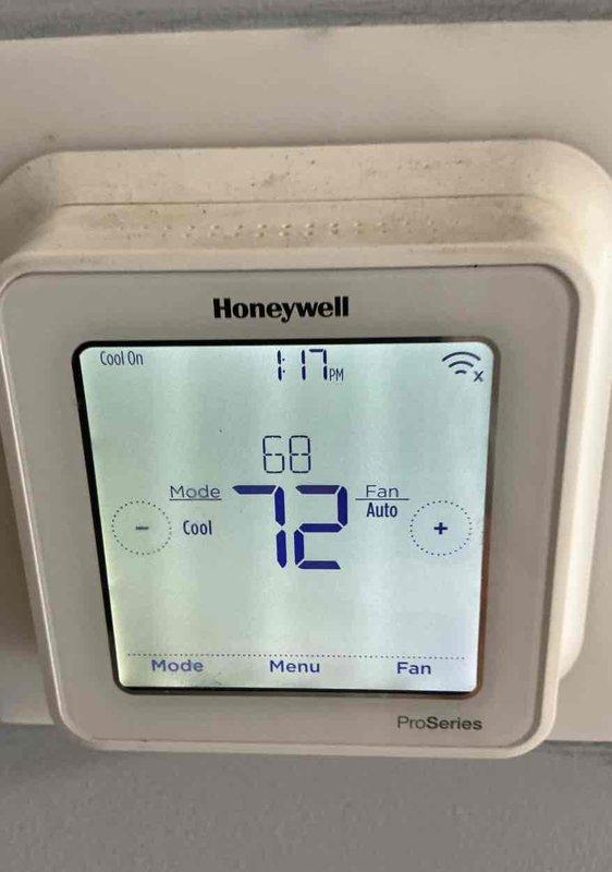 Completed basic monthly cooling maintenance on residential HVAC system. Performed standard inspection of outdoor condenser unit and verified Honeywell ProSeries thermostat operation showing system cooling properly with setpoint at 68°F and indoor temperature at 72°F. All components operating within normal parameters with system in cooling mode and fan set to auto.