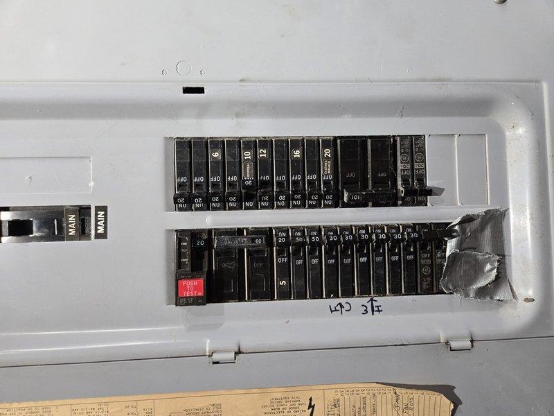 Conducted site visit to assess electrical system experiencing flickering lights despite having a 200A panel. Inspected existing electrical meter installation and main service panel, documenting current configuration with multiple circuit breakers ranging from 20A to 40A capacity. Evaluated electrical infrastructure requirements for installation of new electrical panel upgrade and dedicated wiring circuits for heat pump water heater system.