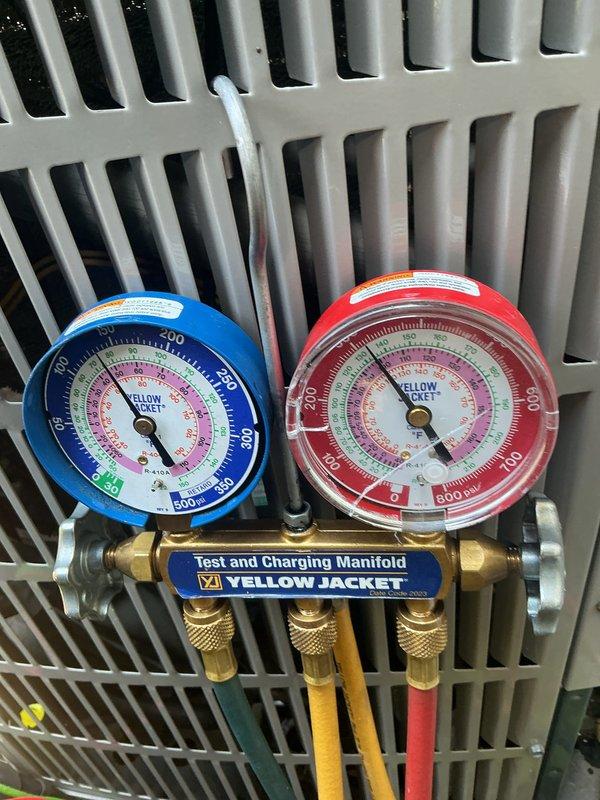 Completed basic cooling maintenance visit including system performance evaluation and filter replacement. Connected manifold gauges to verify refrigerant pressures and system operation, confirming proper cooling cycle function. Installed new 20x22x1 air filter and verified thermostat operation showing system cooling at 75°F setpoint with fan in auto mode.
