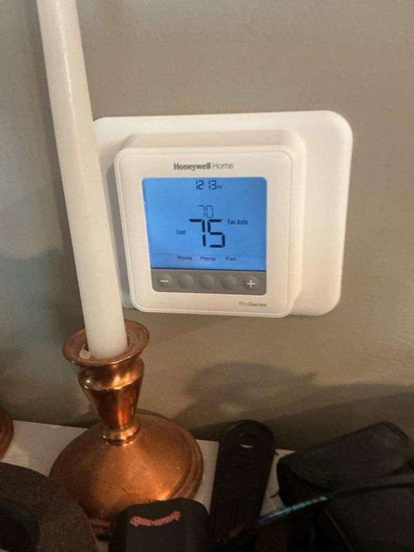 Completed basic cooling maintenance visit including system performance evaluation and filter replacement. Connected manifold gauges to verify refrigerant pressures and system operation, confirming proper cooling cycle function. Installed new 20x22x1 air filter and verified thermostat operation showing system cooling at 75°F setpoint with fan in auto mode.