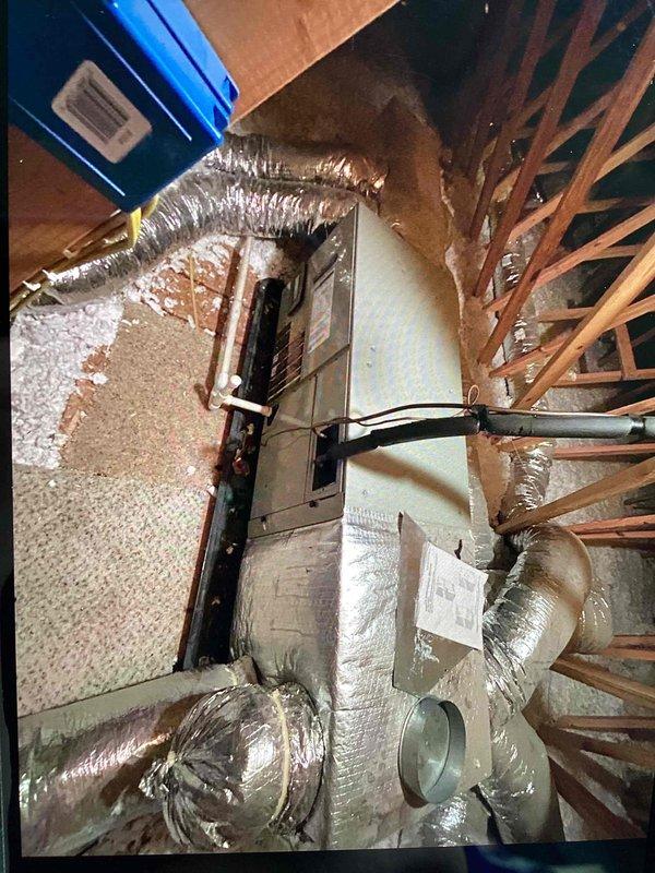 Responded to service call for bedroom experiencing inadequate heating and cooling. Accessed attic space and inspected air handler unit and flexible ductwork distribution system. Evaluated duct connections, insulation integrity, and airflow pathways to identify potential restrictions or disconnections affecting the bedroom zone. Provided estimate for complete duct cleaning service to address airflow issues and restore proper HVAC performance to affected area.