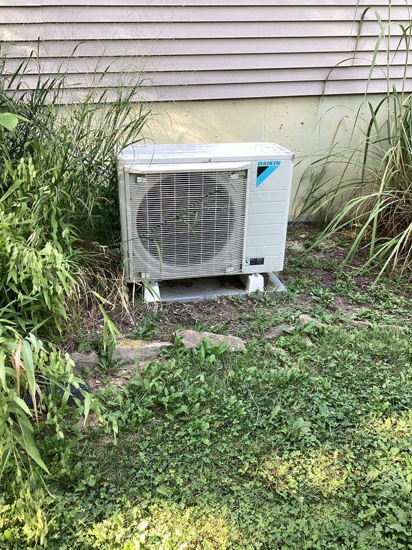 Completed basic monthly cooling maintenance on Daikin system. Thermostat operating properly, displaying 72°F and actively cooling to setpoint of 71°F. Outdoor condenser unit inspected and found operational, though vegetation clearance around unit is recommended for optimal airflow and efficiency. Customer reported reduced airflow to bedroom; system currently cooling adequately, but airflow concern noted for future monitoring and potential ductwork inspection.