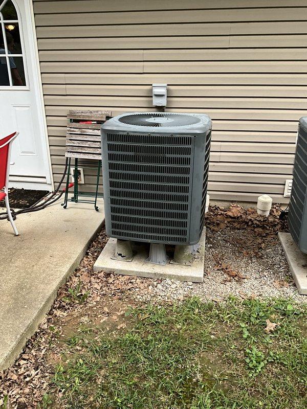 Performed comprehensive assessment of failed 2006 residential cooling system that experienced complete refrigerant loss resulting in coil freeze-up. Evaluated existing indoor air handler with red manufacturer branding and outdoor cylindrical condenser unit with ribbed metal grille to provide second opinion on full system replacement. Documented current equipment condition, refrigerant line routing, electrical connections, and installation configuration including ductwork transitions and mounting locations to develop replacement estimate specifications.