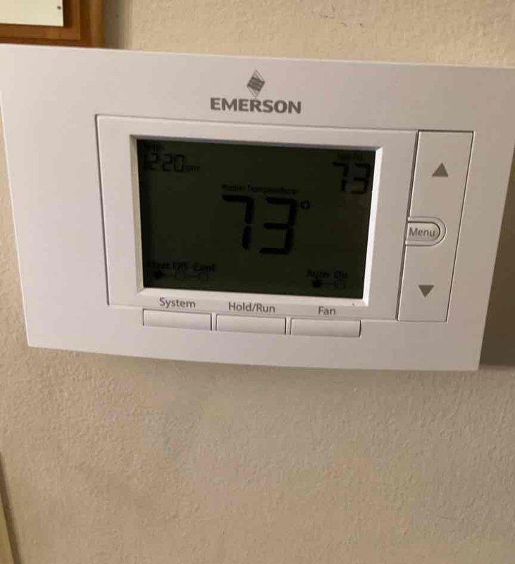 Completed comprehensive cooling maintenance on Lennox HVAC system. Performed standard preventive maintenance procedures including system inspection, operational testing, and verification of thermostat functionality. System operating normally with Emerson programmable thermostat maintaining proper temperature control at 73 degrees.