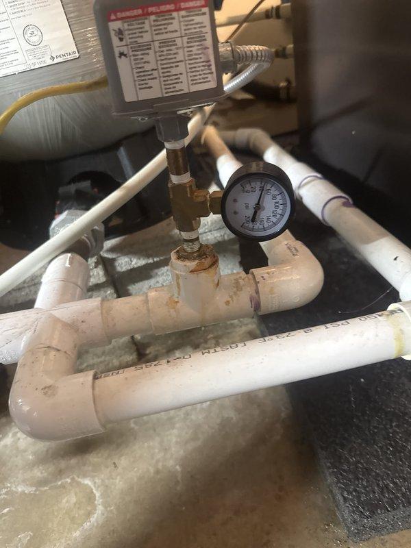 Responded to no water service call and performed diagnostic testing on well pump system. Used clamp meter to verify electrical supply to pump motor, confirming proper voltage present at the unit. Pump failed to start despite adequate power supply, indicating mechanical failure of pump assembly. Inspected pressure tank system and associated plumbing connections. Documented conditions for follow-up pump replacement and water flow restoration by plumbing specialists.