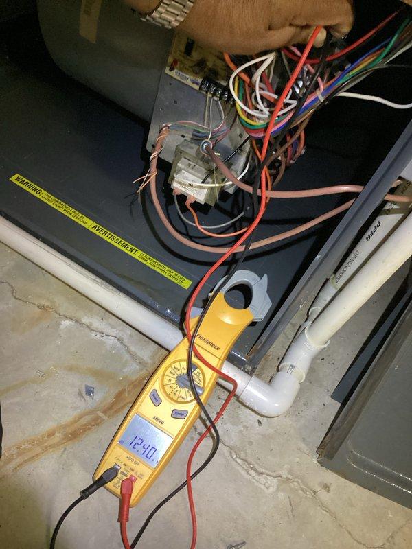 Completed comprehensive heating maintenance service on HVAC system per monthly service agreement. Performed electrical diagnostics using digital multimeter to verify proper voltage and amperage at control panel and wiring connections. Inspected evaporator coil assembly and internal components, confirmed A-frame coil configuration in good condition with no visible debris accumulation. Verified condensate drain lines and drain pan operational, checked sight glass indicator functioning properly. Replaced 20x20x1 air filter per service plan inclusion. All electrical connections tested within normal parameters, system components inspected and found operational with no immediate concerns identified.