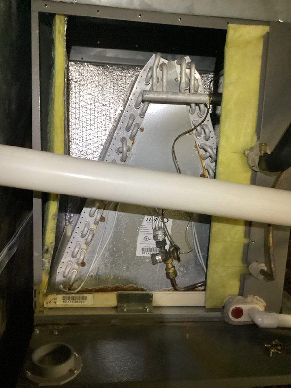 Completed comprehensive heating maintenance service on HVAC system per monthly service agreement. Performed electrical diagnostics using digital multimeter to verify proper voltage and amperage at control panel and wiring connections. Inspected evaporator coil assembly and internal components, confirmed A-frame coil configuration in good condition with no visible debris accumulation. Verified condensate drain lines and drain pan operational, checked sight glass indicator functioning properly. Replaced 20x20x1 air filter per service plan inclusion. All electrical connections tested within normal parameters, system components inspected and found operational with no immediate concerns identified.