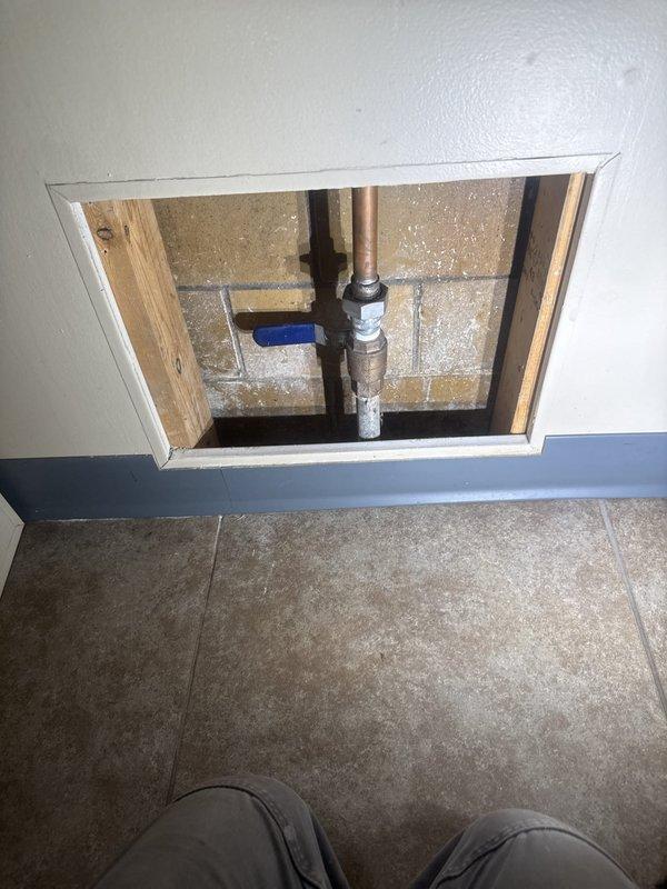 Responded to customer report of abnormally high water consumption indicated by elevated utility billing. Conducted thorough inspection of accessible plumbing infrastructure to locate source of suspected water leak. Accessed wall cavity through existing access panel to examine copper supply lines, PVC drainage system, and shutoff valve assembly. Inspected all visible pipe connections, joints, and fixtures for signs of active leaks, moisture damage, or water intrusion. Documented findings with photographic evidence of plumbing components and surrounding areas for assessment and customer records.