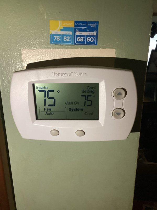 Responded to customer report of intermittent A/C operation. Upon arrival, inspected HVAC system and thermostat operation. Thermostat displayed 75°F with system set to cooling mode. Observed air handler unit with air filter compartment accessible at top of cabinet. Noted 20x20x1 Filtrete filter package on site. Verified system components, checked condensate drainage piping, and confirmed proper thermostat communication with cooling system. Unit operational at time of service with proper temperature control functioning.