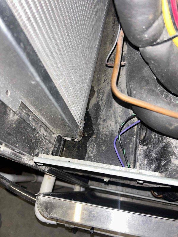 Responded to callback for system not cooling. Upon inspection, found evaporator coil and air handler unit with significant dust accumulation affecting airflow and heat transfer efficiency. Performed thorough inspection of refrigerant lines, condensate drain system, and electrical connections. Cleaned evaporator coil fins and surrounding cabinet housing to restore proper airflow. Verified all PVC condensate piping connections were secure and draining properly. System tested and confirmed cooling operation restored to normal parameters.