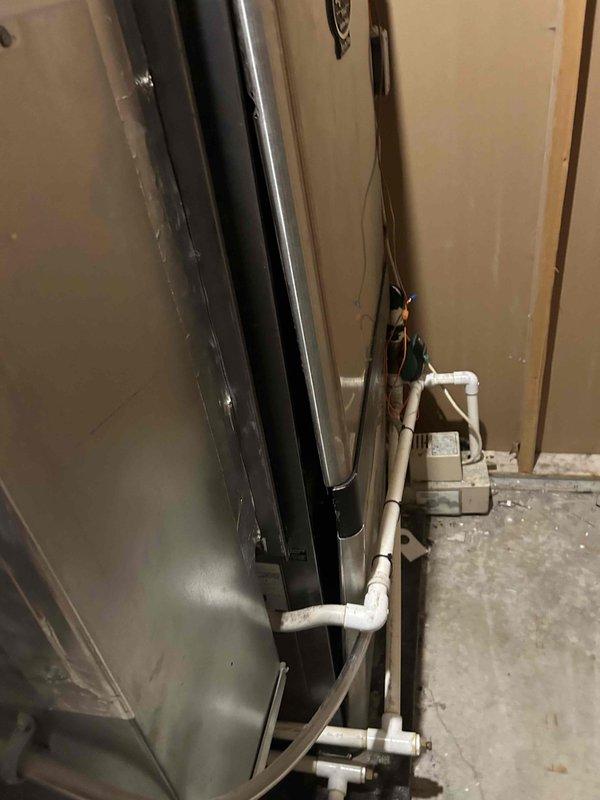 Responded to callback for system not cooling. Upon inspection, found evaporator coil and air handler unit with significant dust accumulation affecting airflow and heat transfer efficiency. Performed thorough inspection of refrigerant lines, condensate drain system, and electrical connections. Cleaned evaporator coil fins and surrounding cabinet housing to restore proper airflow. Verified all PVC condensate piping connections were secure and draining properly. System tested and confirmed cooling operation restored to normal parameters.