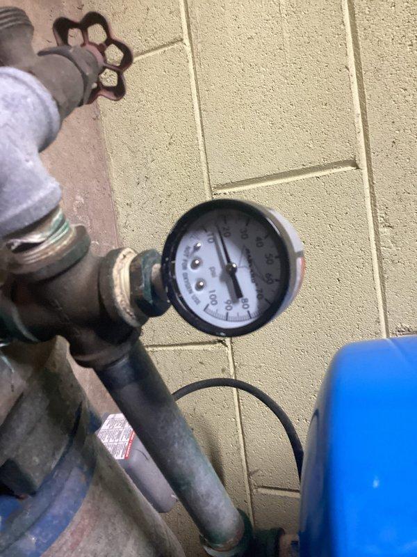 Responded to service alert on geothermal cooling system. Inspected loop pressure gauges and found system pressure within acceptable range; verified all shutoff valves and connections at manifold assembly were secure and functioning properly. Cleared service alert code from thermostat after confirming proper system operation.