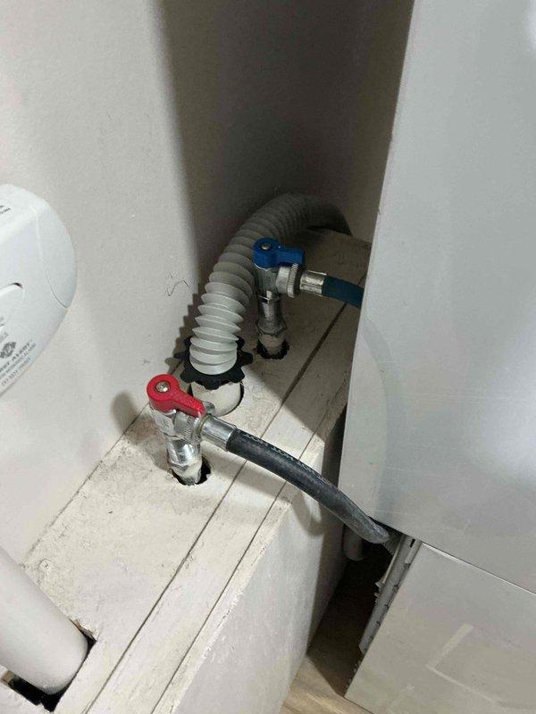 Completed annual plumbing inspection of residential property, examining all accessible water supply lines, shut-off valves, and drain assemblies. Inspected kitchen sink P-trap configuration with garbage disposal connections and water heater installation including hot and cold supply valves with flexible connectors, confirming all components are functioning properly with no visible leaks or deterioration detected.