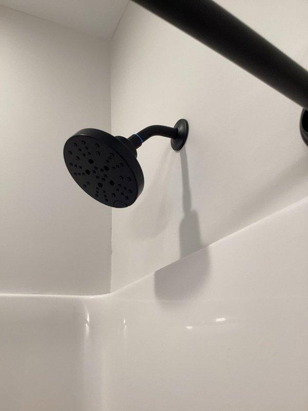 Completed comprehensive plumbing inspections on both units of a duplex property. All fixtures, including bathroom shower installations with matte black hardware and wall-mounted showerheads, were examined and found to be in proper working condition with no leaks or deficiencies noted.