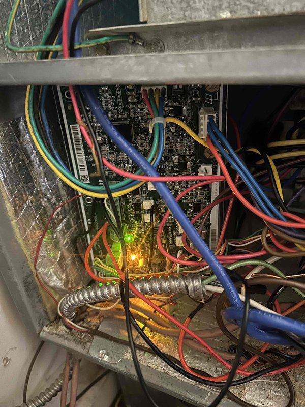 Returned to site and successfully replaced the defective indoor control board. Disconnected all existing wire harnesses and power connections from the failed board, installed new control board in the electrical cabinet, and reconnected all multi-conductor wiring including power leads and communication cables to proper terminals. Verified all connections were secure, tested system operation, and confirmed proper functionality with LED indicators showing active status.