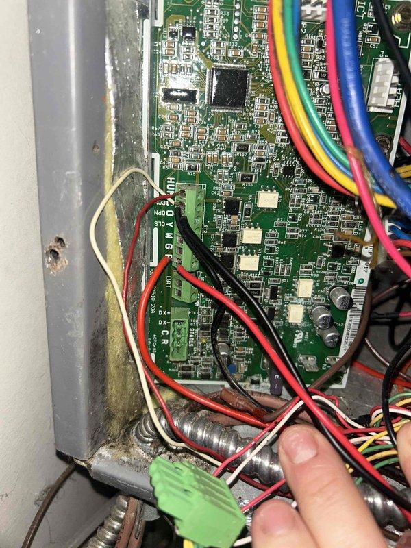 Returned to site and successfully replaced the defective indoor control board. Disconnected all existing wire harnesses and power connections from the failed board, installed new control board in the electrical cabinet, and reconnected all multi-conductor wiring including power leads and communication cables to proper terminals. Verified all connections were secure, tested system operation, and confirmed proper functionality with LED indicators showing active status.