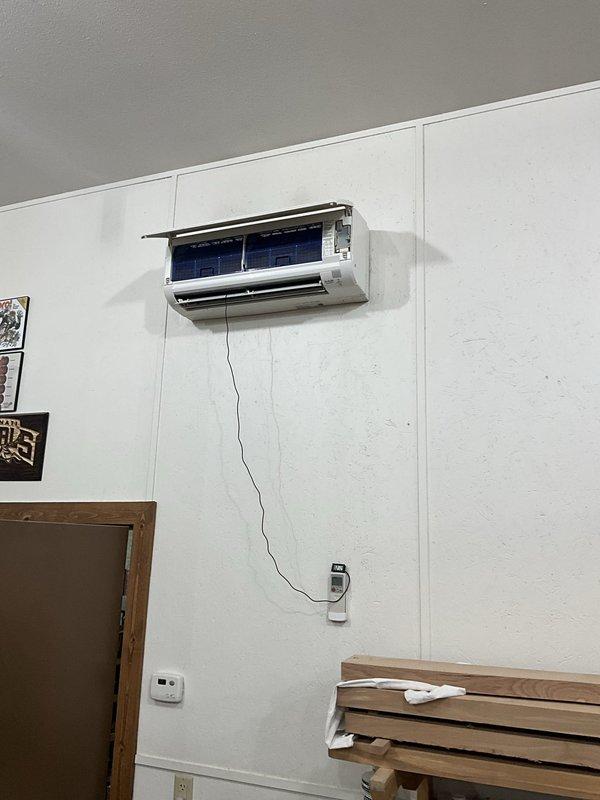 Provided comprehensive estimate for complete mini split system replacement. Evaluated existing wall-mounted indoor evaporator unit with exposed internal components and assessed outdoor condensing units requiring replacement due to age and deterioration. Documented current system configuration, electrical connections, refrigerant line routing, and mounting locations to prepare detailed proposal for new equipment installation.