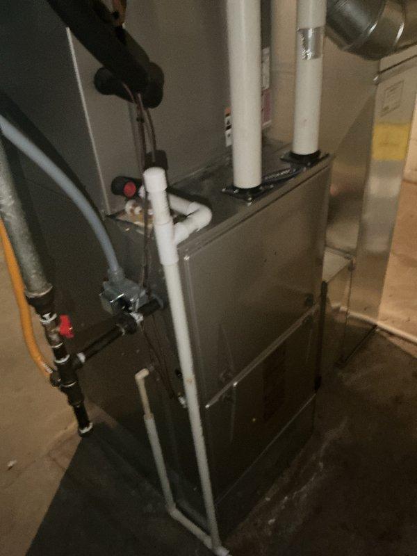Completed Basic Cooling Visit - Monthly recurring maintenance service. Performed standard inspection of residential HVAC system located in basement utility area. System consists of gray metal furnace cabinet with associated ductwork, condensate drainage piping, and gas supply lines with shutoff valves. Verified proper operation of cooling components and airflow distribution through metallic supply ductwork. Inspected condensate drain system including white PVC drain lines for proper drainage and absence of blockages. Checked gas supply connections and shutoff valves for secure operation. Noted 20x25x4 filter size for system (filter not included in this service). All equipment operating within normal parameters at time of inspection. System ready for continued operation.