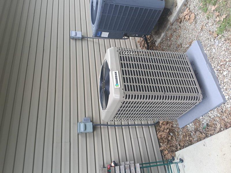 Completed full heat pump system installation for mobile home application. Installed outdoor heat pump unit on composite deck platform adjacent to existing HVAC equipment, ensuring proper clearances and secure mounting. Verified system operation with temperature readings confirming proper refrigerant charge and airflow, with supply air temperature measuring 33.3°F indicating correct cooling performance.
