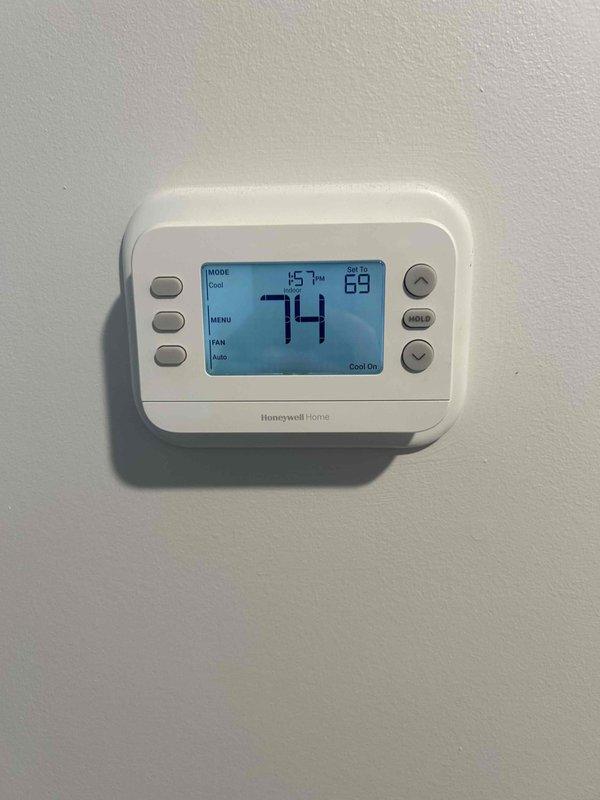 Responded to service call for non-responsive heat pump and clogged condensate drain line on Bosch air handler system. Successfully cleared blockage from furnace condensation drain line using appropriate methods to restore proper drainage. Inspected heat pump operation and thermostat functionality, verified system response and cooling operation at 74°F ambient with setpoint at 68°F. Confirmed all mechanical components, refrigerant lines, ductwork connections, and PVC drain lines are secure and functioning properly with no visible defects or leaks.