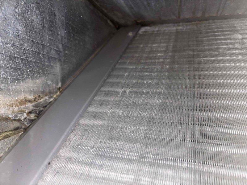 Completed basic monthly cooling maintenance visit on HVAC system. Replaced standard air filter measuring 16 3/8 x 21 1/2 x 1 inch as part of recurring preventive maintenance program. Inspected evaporator coil and noted moderate dust and dirt accumulation on aluminum fins with debris collection in drain pan area, which is consistent with normal operational wear between service intervals. Unit operating within normal parameters with all components functioning as designed.