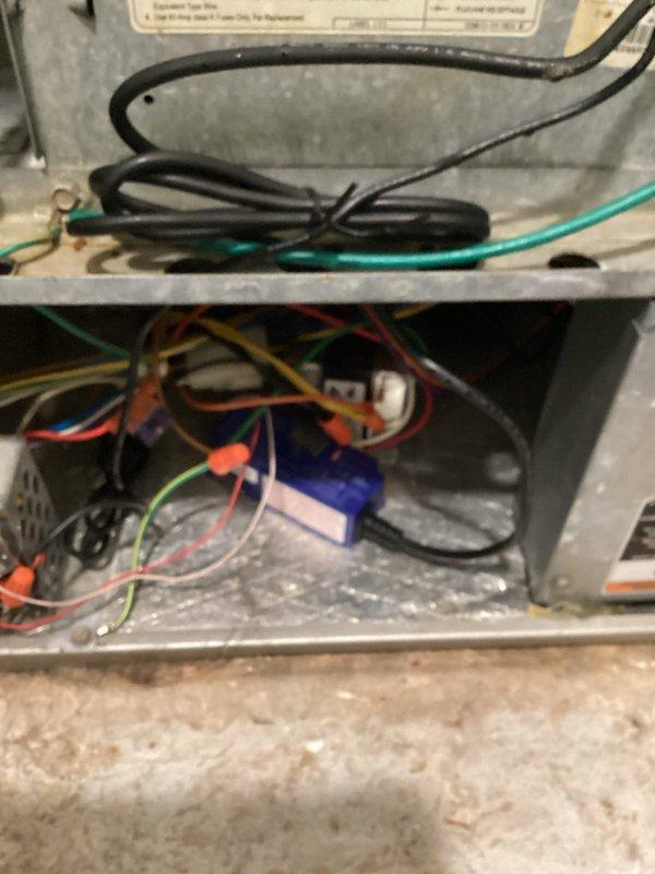 Replaced UV bulb in air handling unit and repaired thermostat wiring in electrical compartment. Verified proper operation of UV light system and confirmed all thermostat wire connections were secure with appropriate wire nuts.