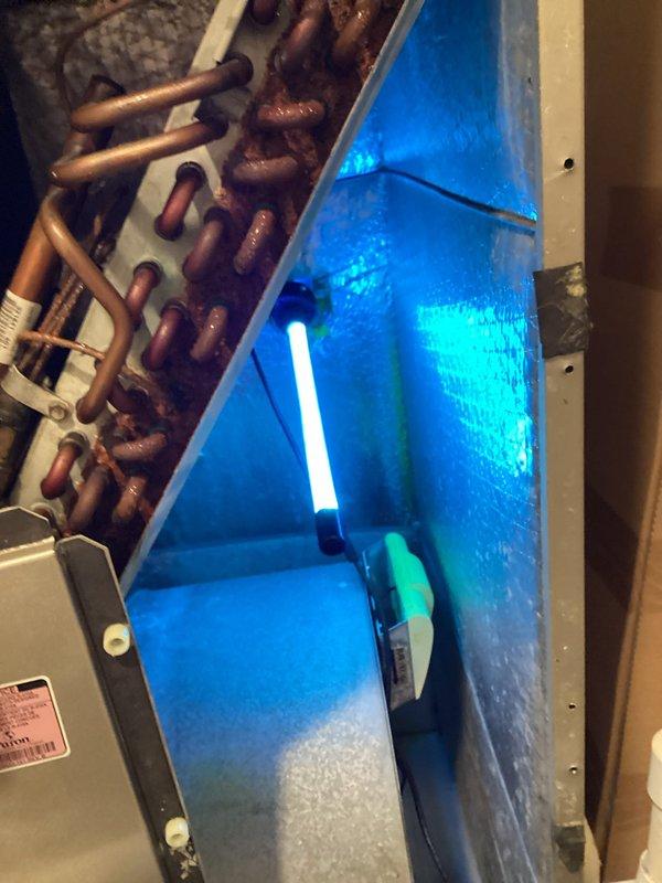 Replaced UV bulb in air handling unit and repaired thermostat wiring in electrical compartment. Verified proper operation of UV light system and confirmed all thermostat wire connections were secure with appropriate wire nuts.