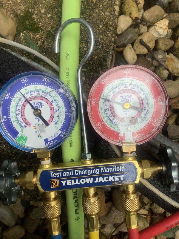 Responded to no-cooling complaint with outdoor fan motor failure on Trane split system. Found condenser fan motor inoperative, causing unit shutdown and excessive condensation accumulation at indoor air handler. Verified system pressures using manifold gauges, confirmed proper refrigerant charge, and unit currently remains off pending condenser fan motor replacement to restore normal cooling operation.