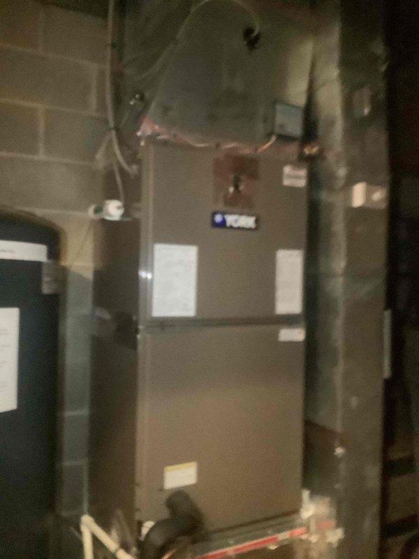 Responded to no-cooling complaint with outdoor fan motor failure on Trane split system. Found condenser fan motor inoperative, causing unit shutdown and excessive condensation accumulation at indoor air handler. Verified system pressures using manifold gauges, confirmed proper refrigerant charge, and unit currently remains off pending condenser fan motor replacement to restore normal cooling operation.