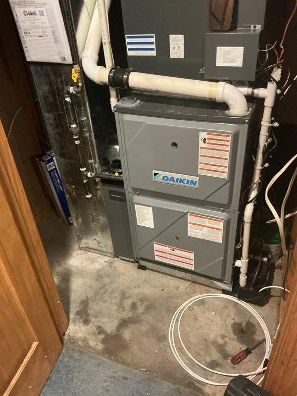 Completed prepaid preventive maintenance tune-up on 3-year-old Daikin split system including both indoor furnace unit and outdoor condenser. Performed comprehensive inspection of indoor air handler located in utility closet, checking all electrical connections, verifying proper airflow, and inspecting PVC condensate drain lines and refrigerant line connections. Serviced outdoor condenser unit, cleaning coils, checking refrigerant charge, testing capacitor and contactor operation, and verifying proper fan motor function. All components operating within manufacturer specifications with no deficiencies noted. System ready for continued reliable cooling operation.