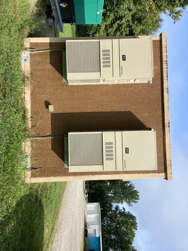 Responded to service call for dual HVAC system with one unit producing excessive noise and inadequate cooling performance. Performed diagnostic inspection on both Bard Manufacturing units located in outdoor wooden enclosure. Identified operational issues on primary unit affecting temperature control. Conducted comprehensive system evaluation on secondary unit to verify proper operation, checking electrical specifications, refrigerant levels, and mechanical components. Documented equipment specifications and installation conditions with photographic records for service history.