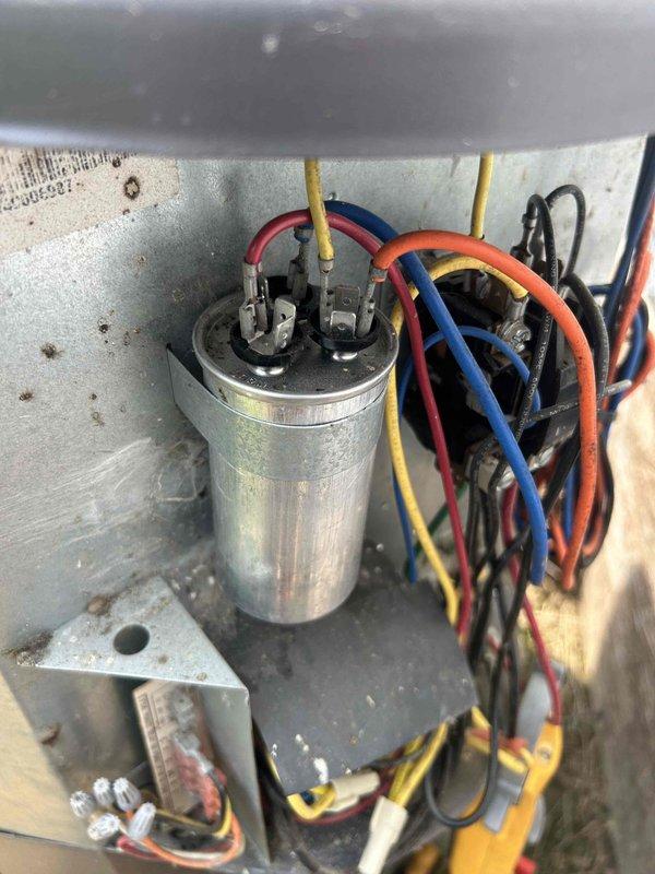 Responded to service call for unit not reaching set temperature. Performed diagnostic testing on Maytag condensing unit and inspected electrical components within the equipment panel. Evaluated capacitor condition, verified wire connections at terminals, and assessed overall system operation to identify cooling deficiency.