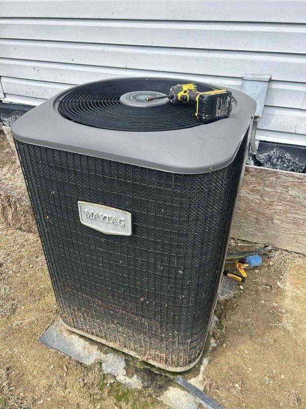 Responded to service call for unit not reaching set temperature. Performed diagnostic testing on Maytag condensing unit and inspected electrical components within the equipment panel. Evaluated capacitor condition, verified wire connections at terminals, and assessed overall system operation to identify cooling deficiency.