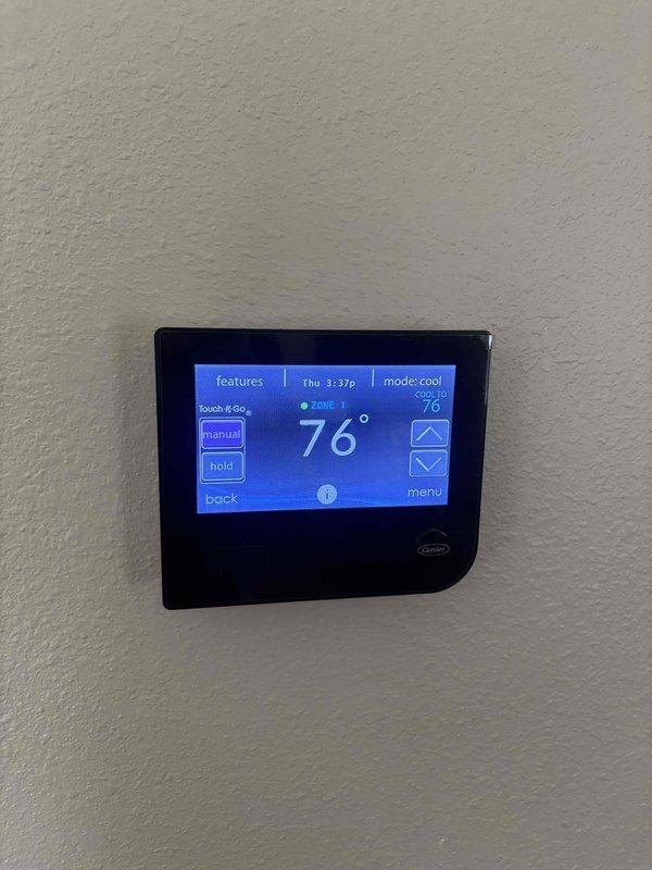 Completed Basic Cooling Visit monthly recurring service maintenance, which included replacing the 20x25x4 air filter provided with membership. Verified thermostat operation showing Zone 1 cooling mode functioning properly at 76°F setpoint, and documented existing water heater installation in mechanical room for reference.