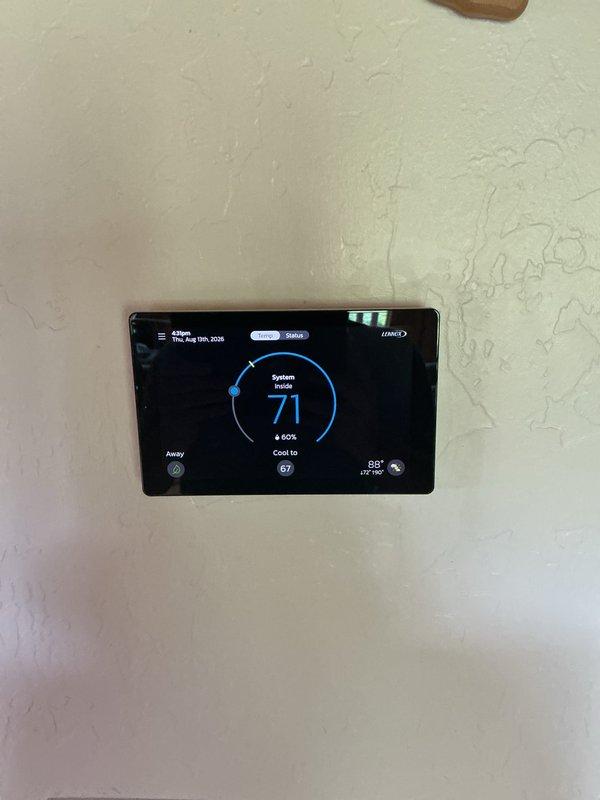 Completed annual cooling maintenance visit on Lennox Dave Lennox Signature Collection CBX48MVT air handler system utilizing R454B refrigerant. Performed comprehensive system inspection, verified thermostat operation showing proper cooling mode function with setpoint at 67°F, and documented service history on equipment labeling. System operating within normal parameters with no deficiencies noted.