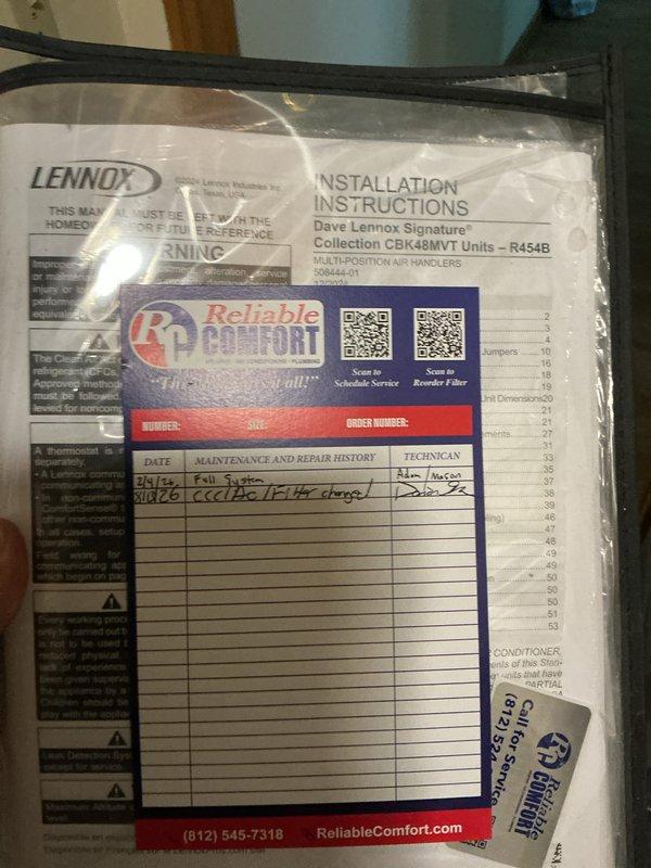 Completed annual cooling maintenance visit on Lennox Dave Lennox Signature Collection CBX48MVT air handler system utilizing R454B refrigerant. Performed comprehensive system inspection, verified thermostat operation showing proper cooling mode function with setpoint at 67°F, and documented service history on equipment labeling. System operating within normal parameters with no deficiencies noted.