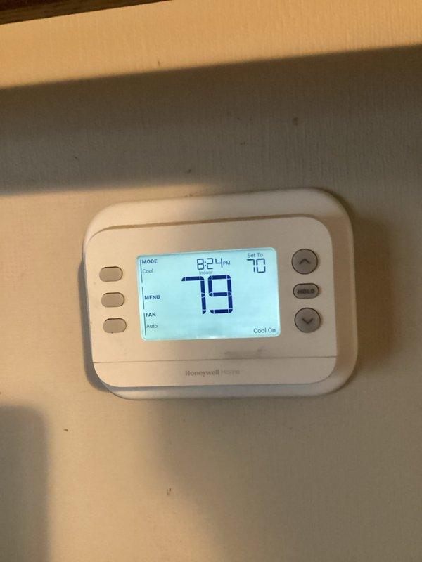 # HVAC Service Report

Responded to emergency no-cooling call on heat pump system less than one year old with history of recent service issues. Upon arrival, found thermostat displaying 79°F ambient temperature with setpoint at 70°F in cooling mode, but system not operating. Inspected indoor air handler unit and confirmed heat pump was not running. Performed diagnostic testing to identify root cause of failure. Troubleshot electrical connections, control board functionality, and safety switches. Restored system to operational status and verified proper cooling cycle engagement. Confirmed thermostat communication with equipment and proper temperature differential response. System running normally at time of departure with cool air delivery confirmed.