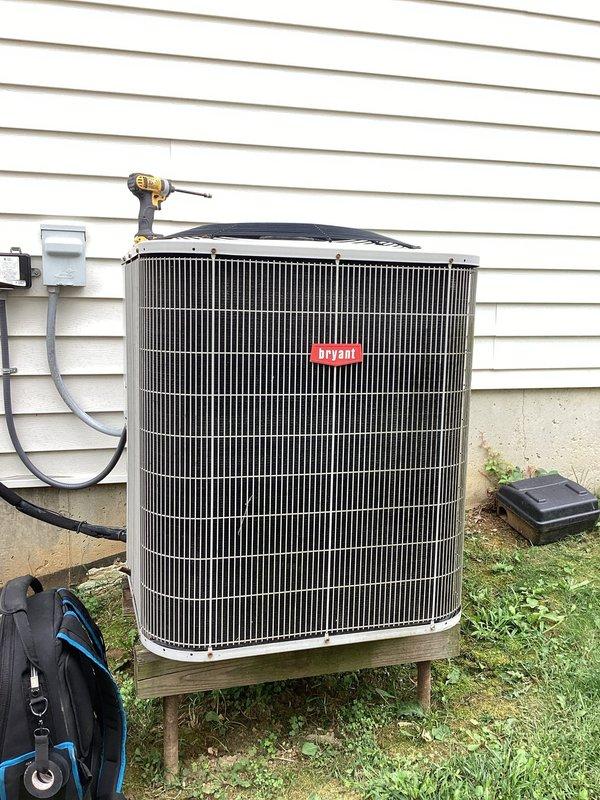 Responded to emergency no-cooling call for 15-year-old Bryant A/C system where outdoor unit was attempting to start but failing to run. Upon arrival, diagnosed failed start capacitor with multimeter reading of 6.00 microfarads, well below manufacturer specifications. Replaced defective dual run capacitor, tested system operation, and verified proper amperage draw and compressor function. Unit restored to normal cooling operation.