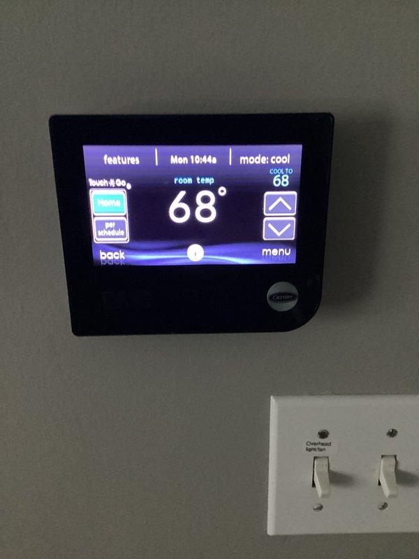 Completed scheduled AC tune-up and preventative maintenance on 2019 Carrier system located in attic space. Performed comprehensive inspection of all components, verified thermostat operation showing proper cooling mode at 68°F setpoint, checked airflow and ductwork connections, and confirmed system is operating within manufacturer specifications.