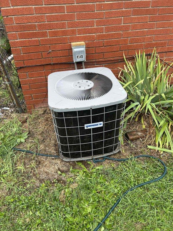 Completed basic monthly cooling maintenance visit on residential air conditioning system. Inspected outdoor condenser unit positioned against exterior brick wall, verified proper clearances and airflow around unit. Examined electrical components including capacitor, contactor assembly, and associated wiring connections for signs of wear or deterioration. Replaced 16x25x1 air filter per maintenance agreement. Noted dust accumulation on electrical panel and general aging of components but system operating within normal parameters. All safety labels intact and visible on equipment.