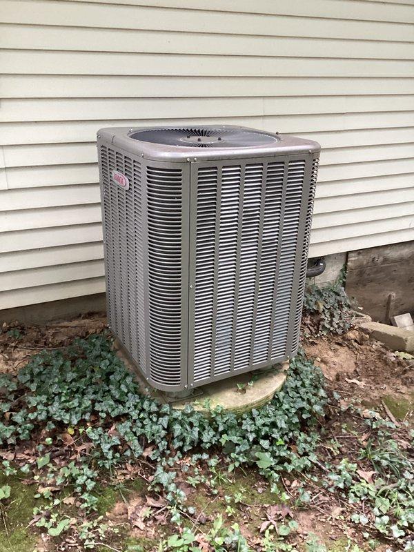 Completed scheduled heating maintenance tune-up on 9-year-old heat pump system. Performed comprehensive system diagnostics using digital multimeter to verify electrical readings and component operation. Inspected outdoor condenser unit, noting vegetation encroachment around base that may restrict airflow if left unmanaged. All electrical connections tested and found within normal operating parameters, system operating efficiently and ready for heating season.