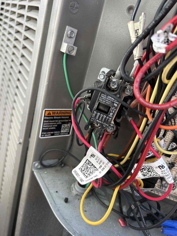 Responded to no cooling call with indoor unit operating but outdoor unit not running. Inspected outdoor condensing unit electrical components including contactor, wiring connections, and control panel. Diagnosed failure in outdoor unit electrical system, documented all wire connections and component conditions with photographs for service records.