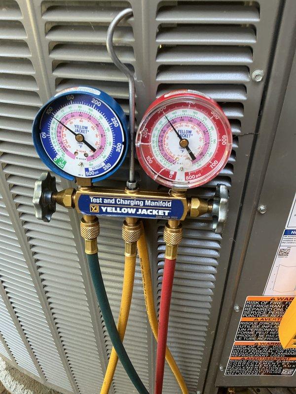 Performed post-installation tune-up and system verification on newly installed HVAC cooling system. Connected Yellow Jacket test and charging manifold to measure refrigerant pressures and verify proper charge levels. Inspected air handler components, control board connections, and electrical wiring for proper installation and operation. All system parameters found within manufacturer specifications, unit operating as designed.