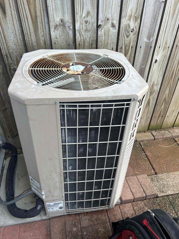 Responded to no-cooling complaint on 11-year-old air conditioning system where outdoor compressor unit had stopped operating. Upon arrival, performed diagnostic testing on condenser unit using clamp meter to measure electrical values at capacitor and compressor terminals. Identified failed run capacitor preventing compressor from starting. Replaced defective capacitor with new unit, verified proper voltage and amperage readings, and confirmed compressor operation restored. System tested and operating normally with proper cooling cycle.