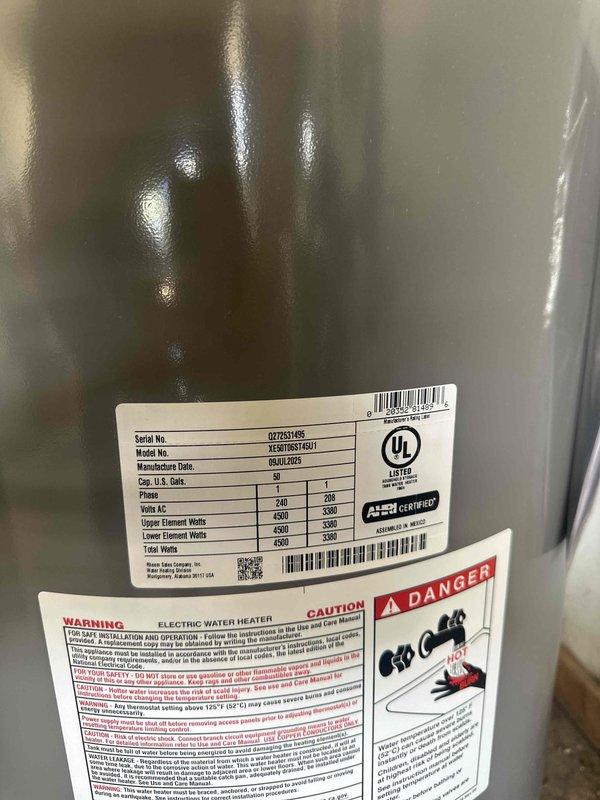 Installed anti-scalding device on 40-gallon electric water heater, model XE40T633F1S/T. Unit specifications confirmed as 240V with 5500W upper element and 4500W lower element, manufactured July 2023. Installation completed and documented with photos showing proper placement and existing water heater labels intact.
