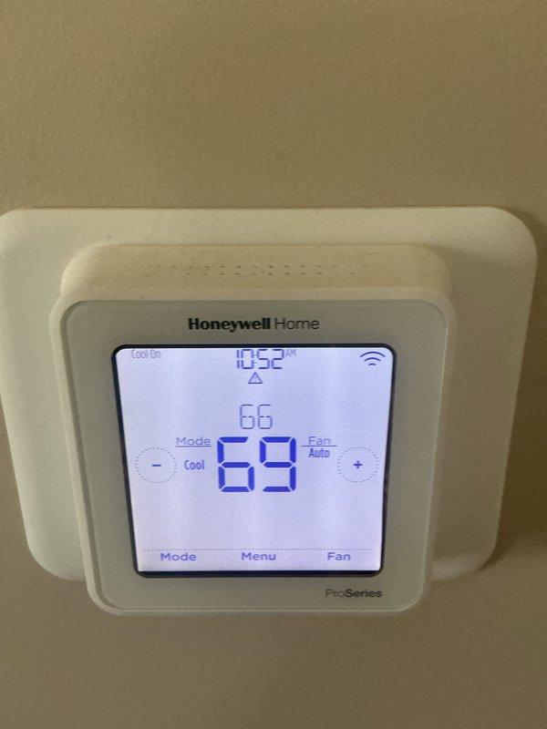 Completed comprehensive AC tune-up and preventative maintenance on one-year-old central air conditioning system. Performed full system inspection including electrical components, capacitor, contactor, and wiring connections in outdoor condensing unit. Verified thermostat operation and calibration on Honeywell Home ProSeries digital unit, confirming proper communication and temperature control functionality. All electrical connections secure, refrigerant levels adequate, and system operating within normal parameters with no issues identified.