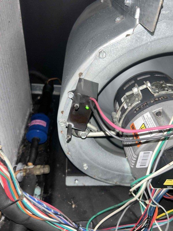 Completed basic monthly cooling maintenance on residential HVAC system. Inspected blower motor assembly, capacitor, and electrical connections within air handler unit. Verified proper operation of thermostat controls and system components, documented equipment condition with photos for service records.