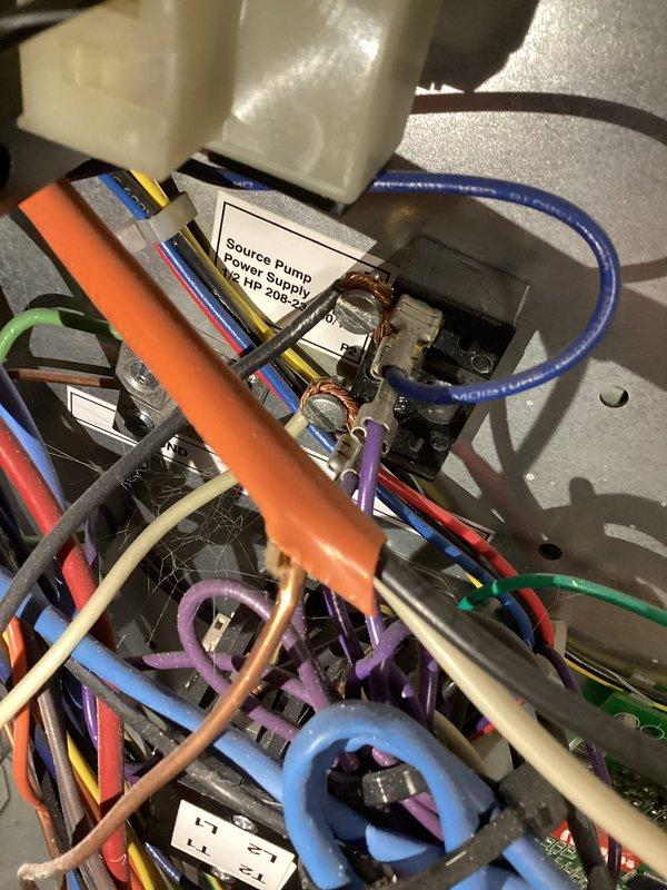 Performed loop conditioner installation and configuration for HVAC unit. Completed electrical connections at control panel, routing and securing multiple low-voltage and line-voltage conductors with proper cable management. Installed and verified pressure monitoring gauge reading 0-100 PSI range on system loop, confirming proper operation of source pump power supply rated at 5 HP 208-230V.